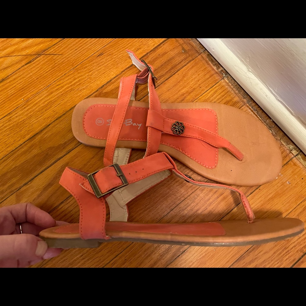 Orange and tan sandals.